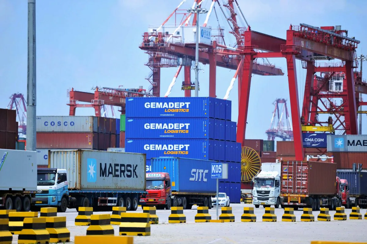 Containers are transferred at a port in Qingdao City, Shandong Province, China on July 6, 2018 (AFP/Getty Images)