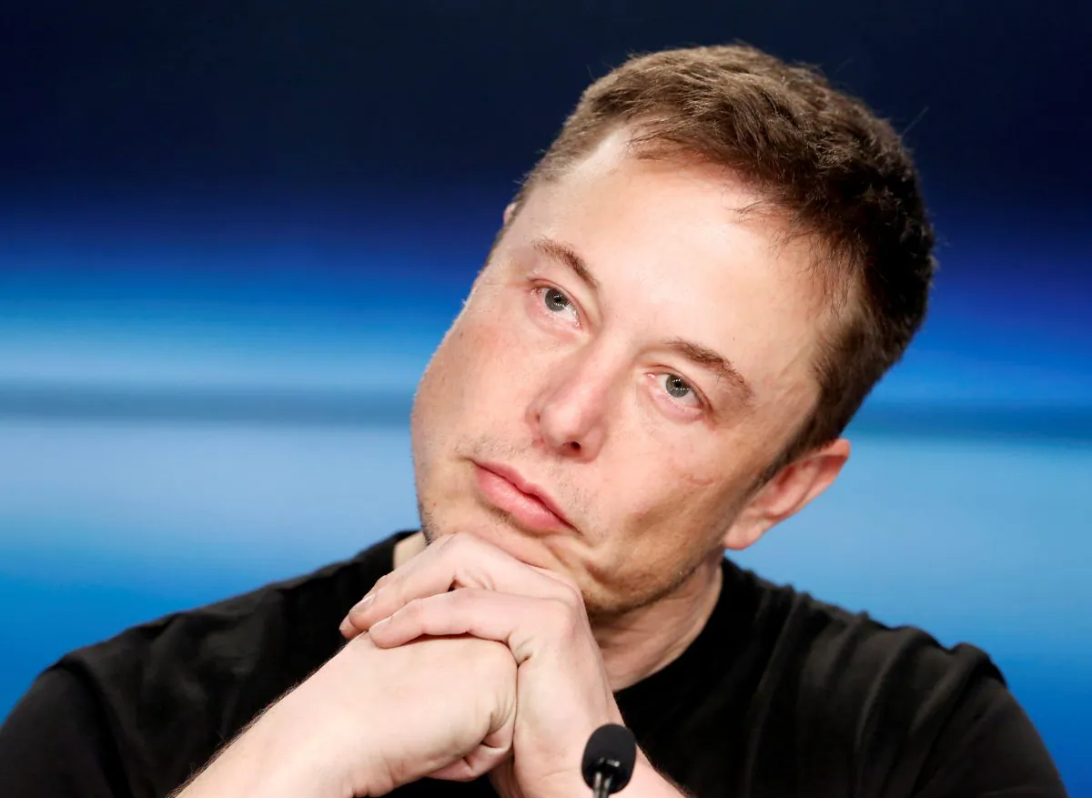 Elon Musk listens at a press conference following the first launch of a SpaceX Falcon Heavy rocket at the Kennedy Space Center in Cape Canaveral, Florida, U.S., February 6, 2018. REUTERS/Joe Skipper/File Photo