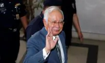 Former Malaysian Prime Minister Leads Party to Landslide Victory in State Elections