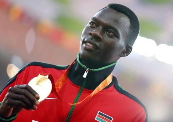 Nicholas Bett of Kenya presents his gold medal on the podium after the men's 400 meters hurdles event during the 15th IAAF World Championships at the National Stadium in Beijing, China, Aug. 26, 2015.