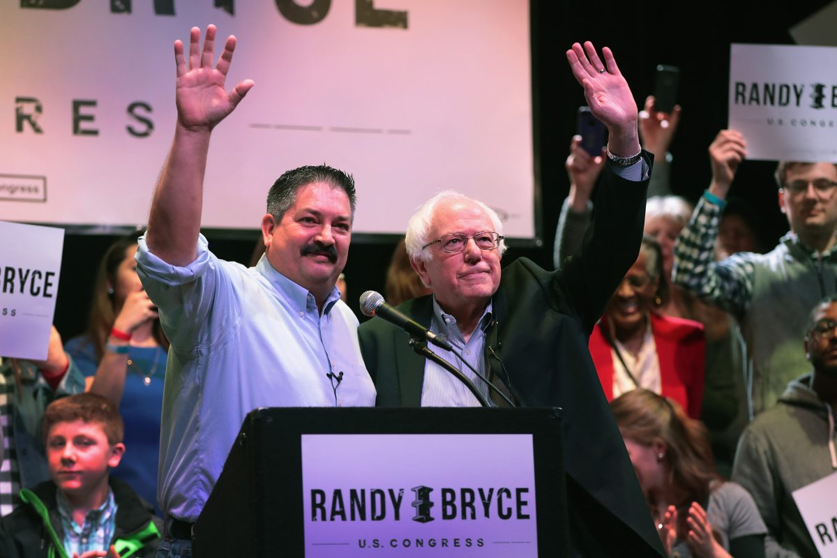Socialist Sen. Bernie Sanders (I-VT) (right) campaigns with congressional candidate Randy Bryce at a rally on Feb. 24, 2018 in Racine, Wisconsin. Bryce takes left-wing positions and is referred to by Wisconsin Republicans as a socialist. (Scott Olson/Getty Images)