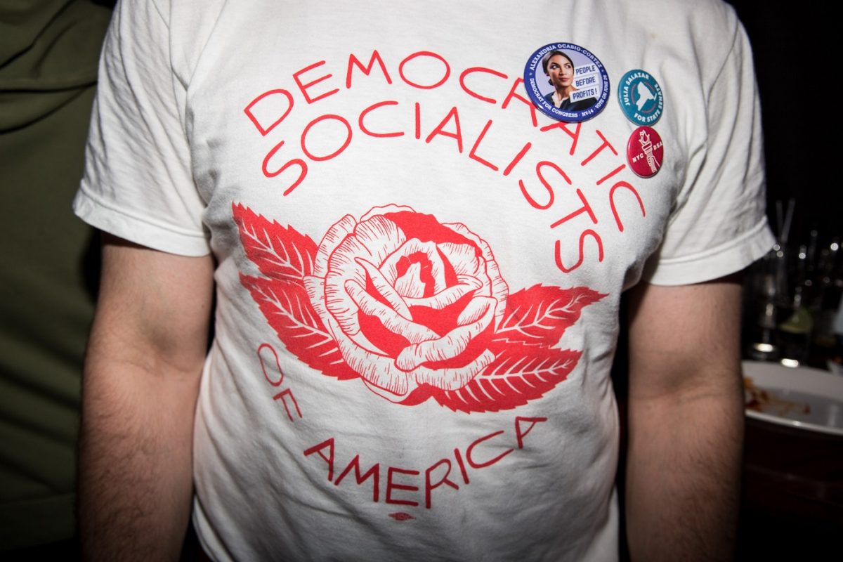 A young man wears a Democrat Socialists of America t-shirt at the victory party for socialist congressional candidate Alexandria Ocasio-Cortez on June 26, 2018 in New York City. (Scott Heins/Getty Images)
