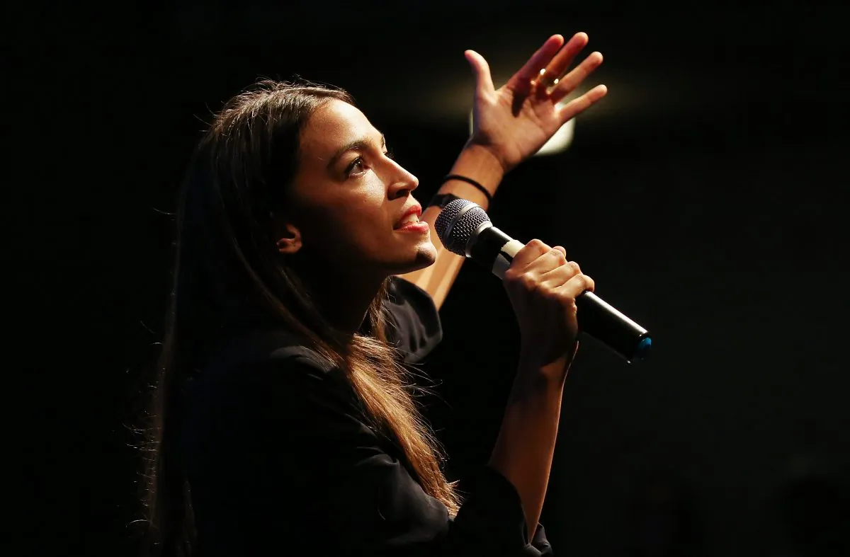 Then congressional candidate Alexandria Ocasio-Cortez (D-N.Y.) speaks at a progressive fundraiser on Aug. 2, 2018, in Los Angeles, California. She is the new face of democratic socialism. (Mario Tama/Getty Images)