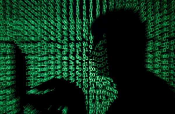 Cyber code is projected on a man.