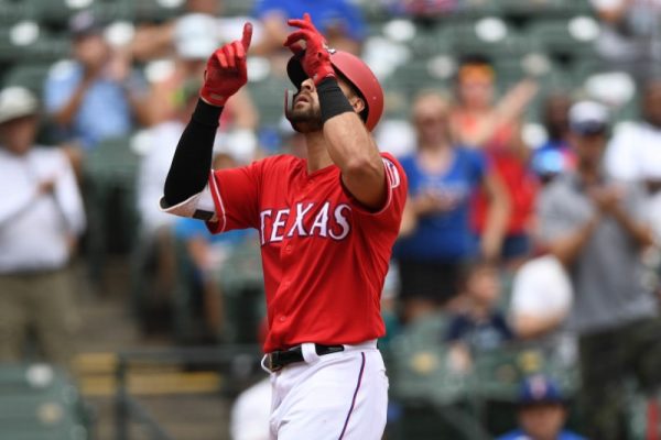 Texas Rangers Joey Gallocrosses home plate after hitting a home run during the third inning against the Seattle Mariners at Globe Life Park in Arlington.