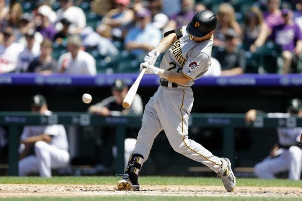 Pittsburgh Pirates Adam Frazier hits a double in the third inning against the Colorado Rockies.