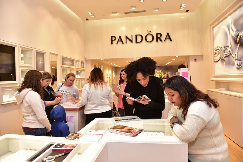 Customers shopping at Pandora jewelry store during a grand opening in Philadelphia, Pa., on May 21, 2016. (Lisa Lake/Getty Images for Pandora)