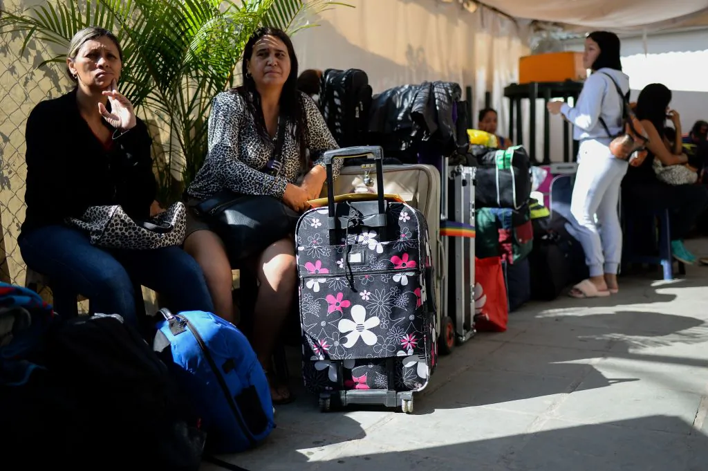 File photo: People queue to buy tickets to travel to Ecuador at a bus terminal in Caracas, on October 11, 2017 as scores of disappointed Venezuelans who see no end to the crisis choose to leave the country. Venezuela, which holds regional elections on October 15, is a country at the top of the Latin American continent that is in deep economic and political crisis. (Federico Parra/AFP/Getty Images)