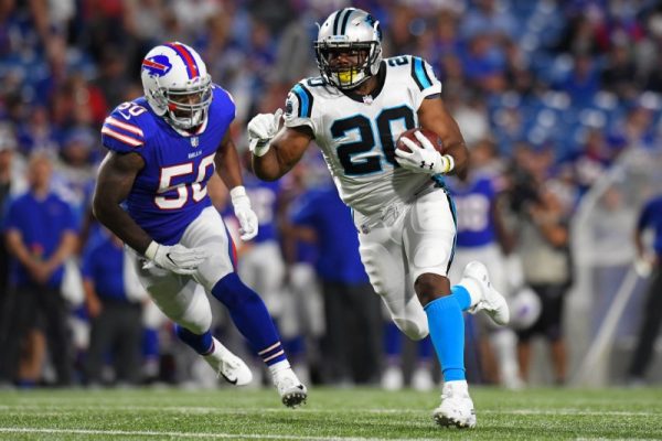 Carolina Panthers running back C.J. Anderson runs with the ball in front of Buffalo Bills linebacker Ramon Humber.