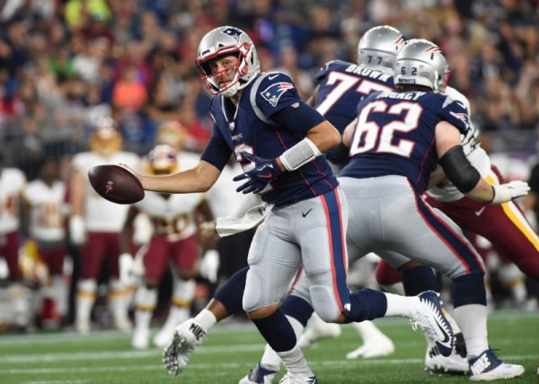 New England Patriots quarterback Brian Hoyer fakes a handoff during the first half against the Washington Redskins.