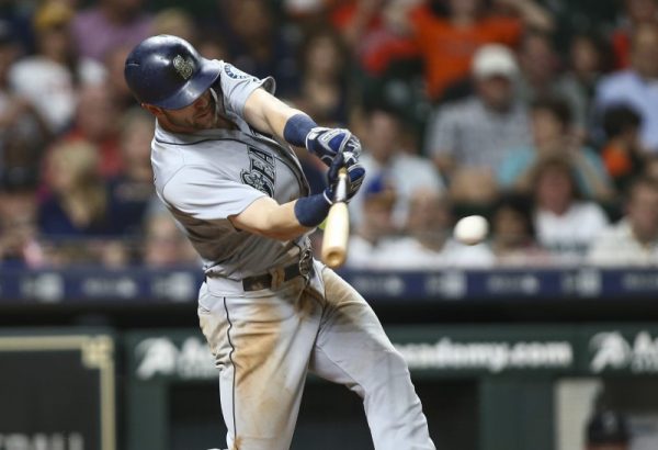 Seattle Mariners Mitch Haniger hits an RBI single during the sixth inning against the Houston Astros.