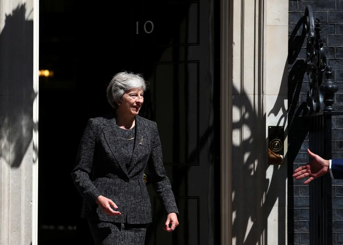 Britain's Prime Minister, Theresa May on the doorstep of 10 Downing Street, London, Britain July 24, 2018. (Reuters/Hannah McKay)
