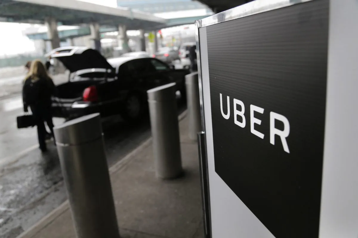 A sign marks a pick-up point for the Uber car service at LaGuardia Airport in New York City on Mar. 15, 2017 (Seth Wenig/AP)
