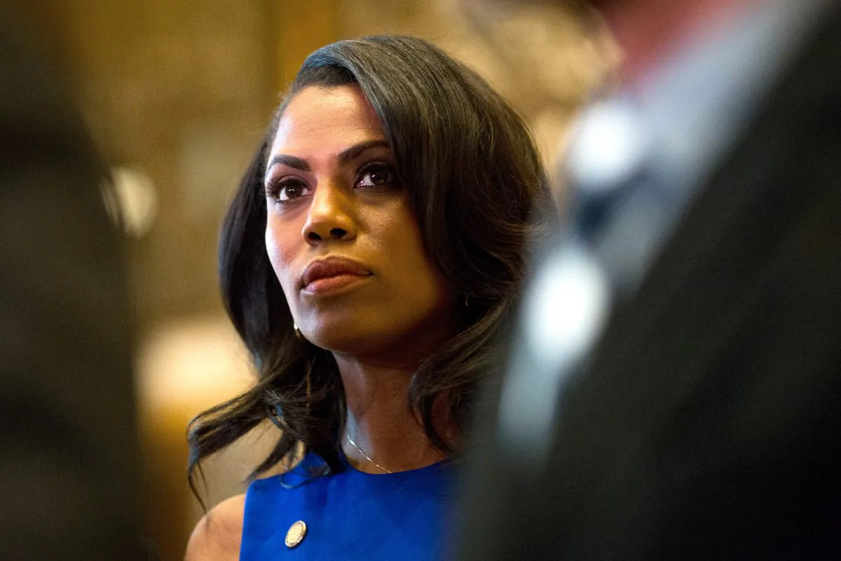 Omarosa Manigault, a former staffer for US President-elect Donald Trump, listens as Martin Luther King III speaks to the media after meeting with the President-elect at Trump Tower in New York City on Jan. 16, 2017. (DOMINICK REUTER/AFP/Getty Images)