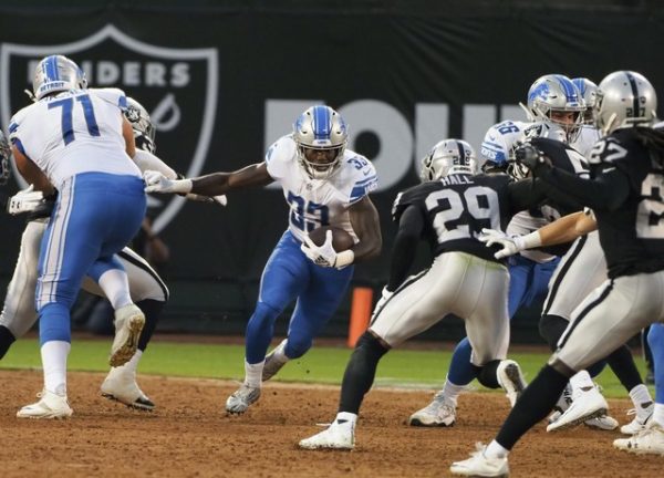 Detroit Lions running back Kerryon Johnson carries the ball against the Oakland Raiders during the first quarter.