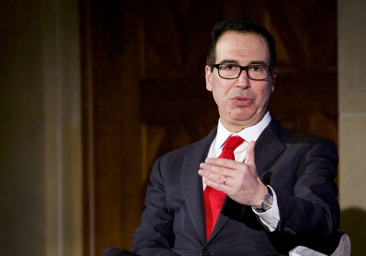 Treasury Secretary Steven Mnuchin (L) speaks at the 3rd Annual Invest in America Summit at the U.S. Chamber of Commerce in Washington on Feb. 27, 2018.  The Treasury Department is currently working on a plan to change the capital gains tax. (Samira Bouaou/The Epoch Times)