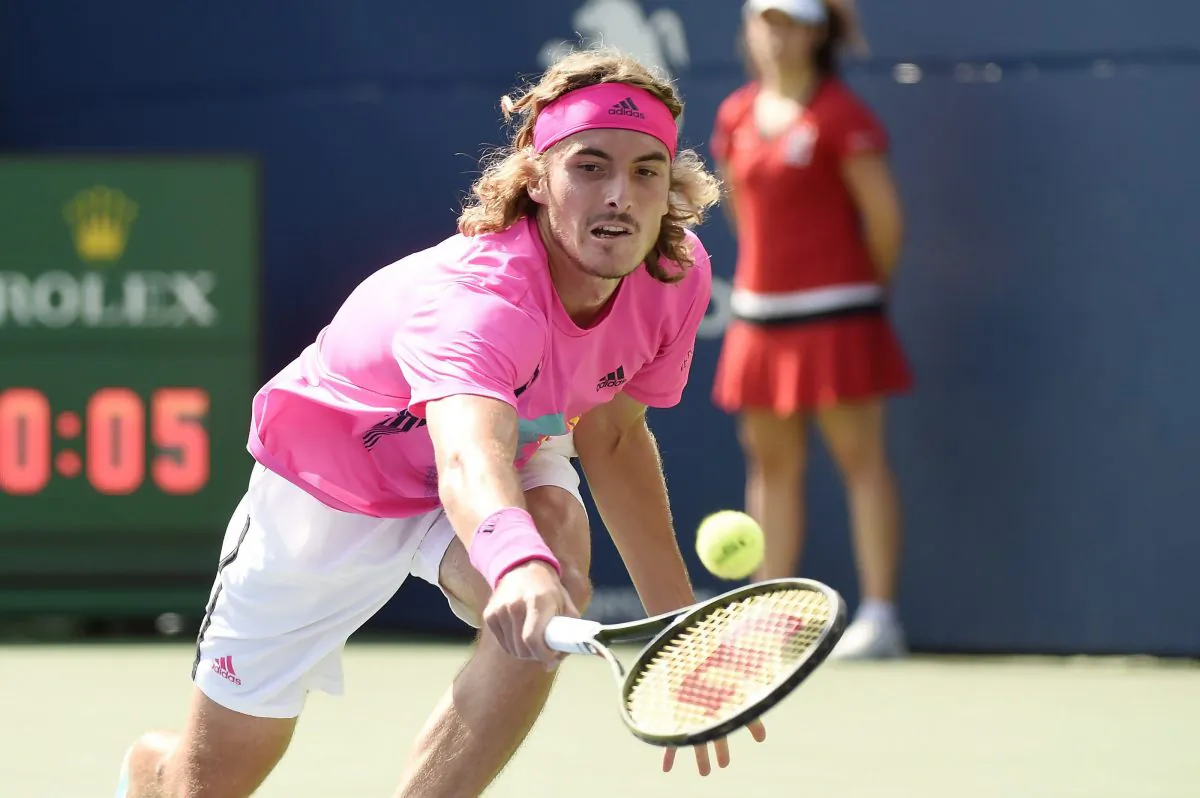 Stefanos Tsitsipas attempts to return a Rafael Nadal serve during the Rogers Cup final in Toronto on Aug. 12, 2018. (The Canadian Press/Nathan Denette)