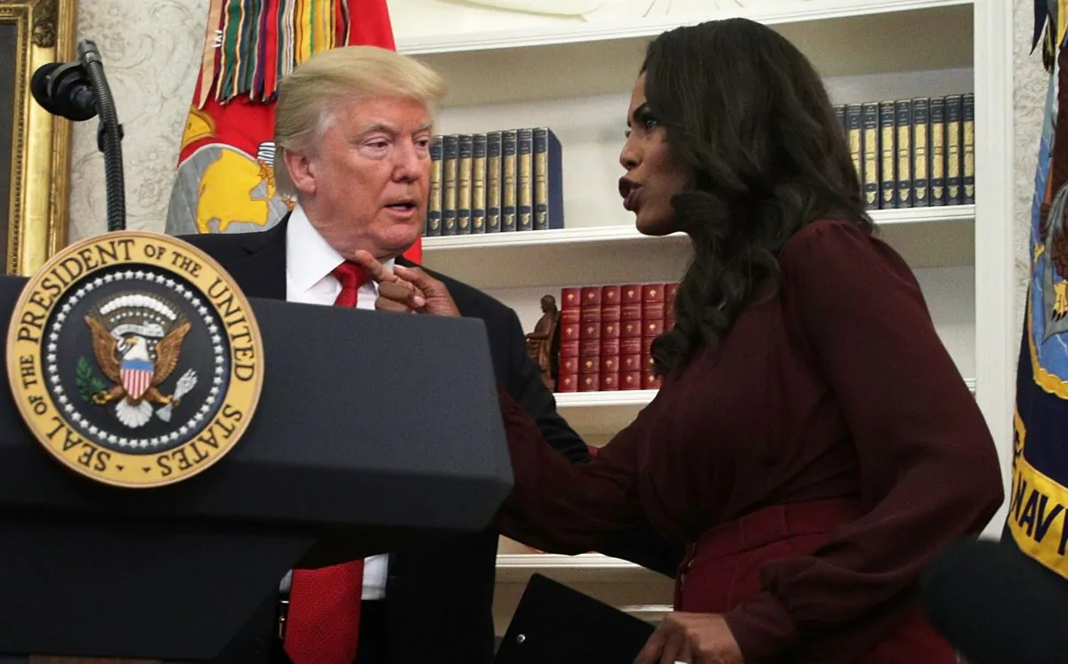 President Donald Trump and then-Director of Communications for the White House Public Liaison Office Omarosa Manigault in the Oval Office of the White House on Oct. 24, 2017. (Alex Wong/Getty Images)