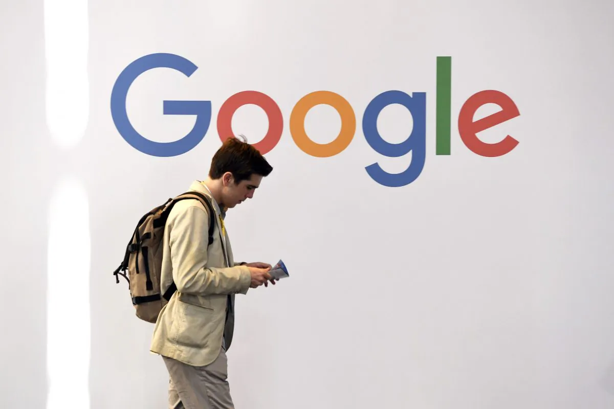 A man walks past the logo of the US multinational technology company Google during the VivaTech trade fair ( Viva Technology), in Paris on May 24, 2018. (ALAIN JOCARD/AFP/Getty Images)