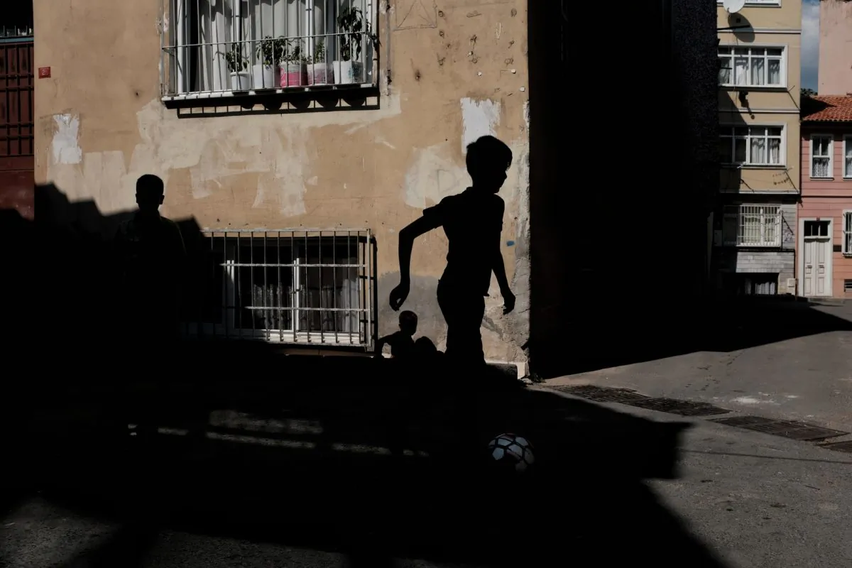 A boy runs down a dark alleyway. (Unsplash)