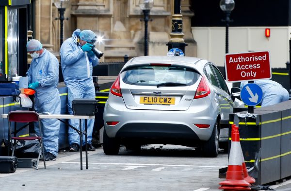 Forensic investigators work at the site