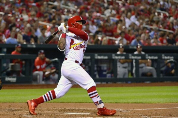Cardinals second baseman Kolten Wong hits a two run double against Washington Nationals starting pitcher Gio Gonzalez during the fourth inning.