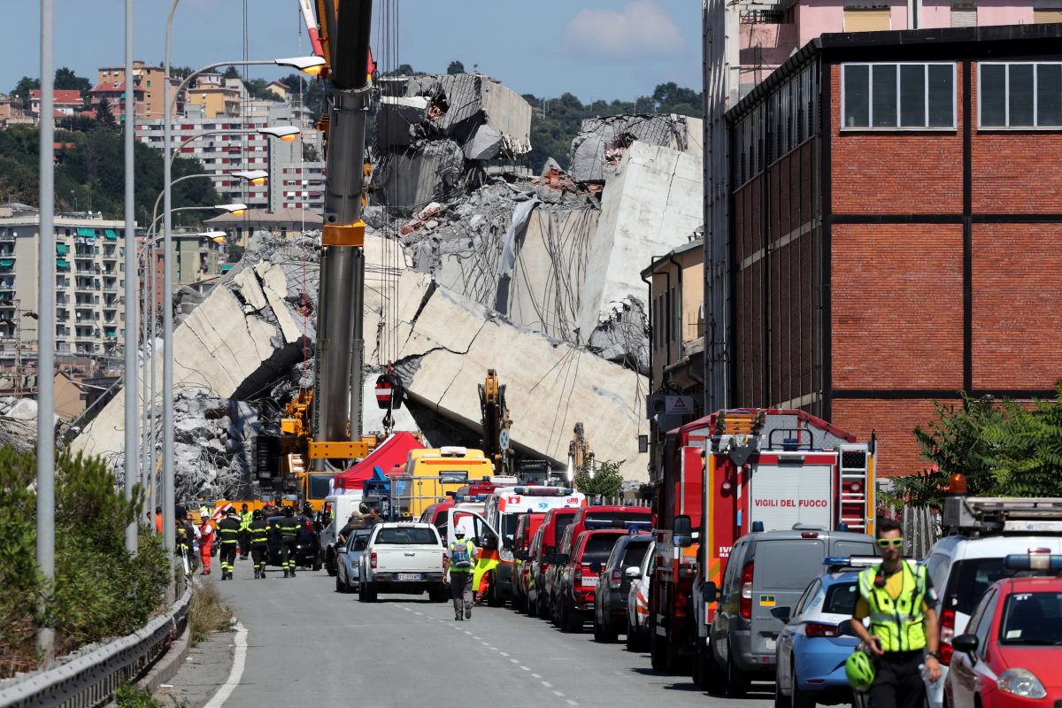 Rescue crews at the site of the Morandi bridge disaster