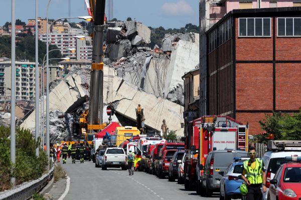 Rescue crews at the site of the Morandi bridge disaster