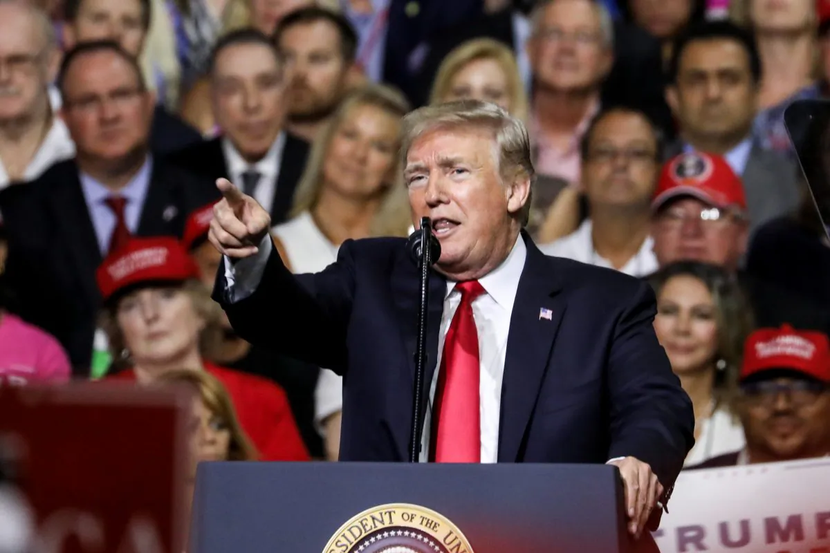 President Donald Trump points to the media while criticizing "fake news" at a Make America Great Again rally in Tampa, Fla., on July 31, 2018. (Charlotte Cuthbertson/The Epoch Times)