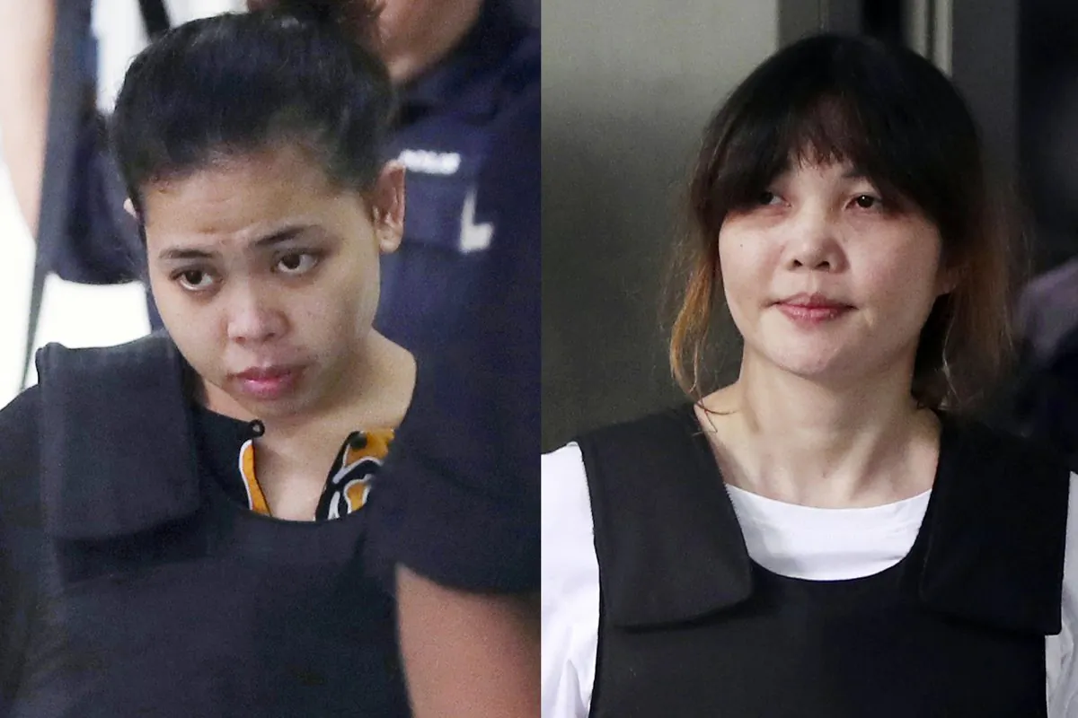 Indonesian Siti Aisyah, left, and Vietnamese Doan Thi Huong, right, escorted by police as they leave a court hearing in Shah Alam, Malaysia, outside Kuala Lumpur on Oct. 2, 2017. Two Southeast Asian women on trial in Malaysia for the brazen assassination of the North Korean leader’s half-brother could be acquitted on Aug. 16, 2018, or called to enter their defense in a case that has gripped the world. (AP Photo/Daniel Chan, File)