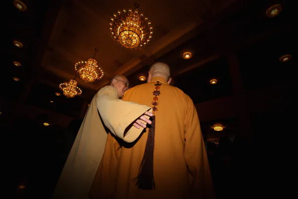 Two Buddhist monk delegates arrive the sixth plenary meeting of the National People's Congress at the Great Hall of the People in Beijing, on March 16, 2013 (Feng Li/Getty Images)
