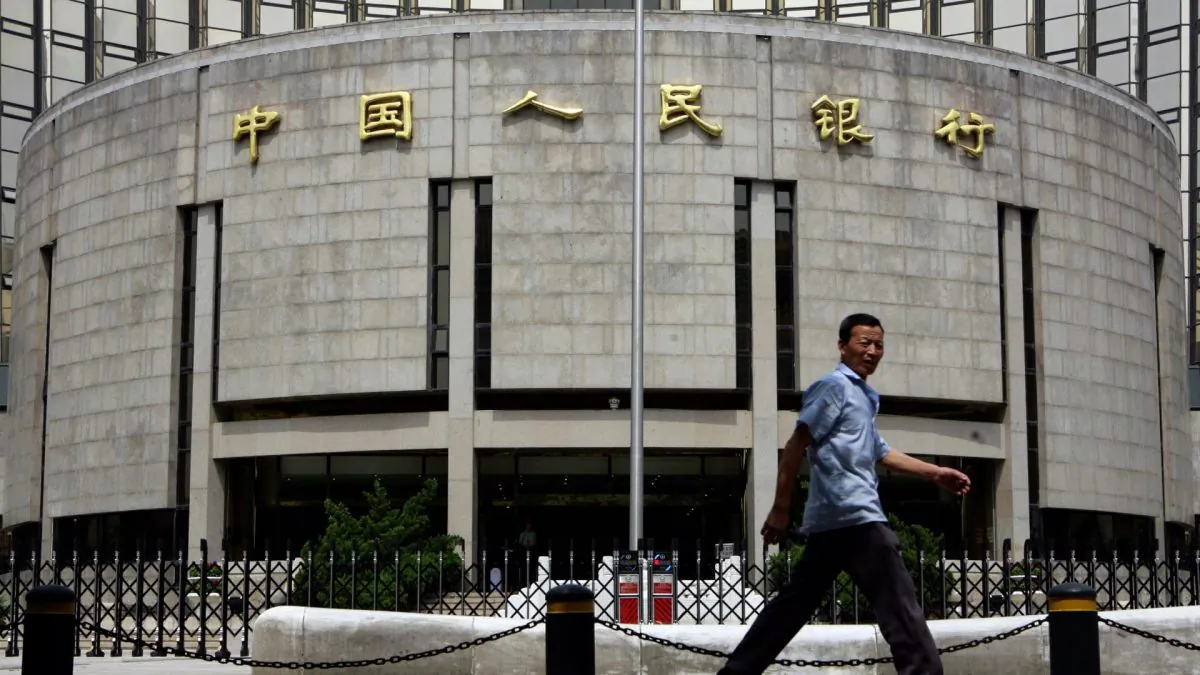 A pedestrian walks past the People's Bank of China, also known as China's Central Bank in Beijing on Aug. 22, 2007. (Teh Eng Koon/AFP/Getty Images)