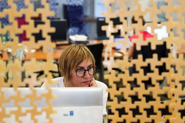 A programmer works on a computer in Belgrade, Serbia.