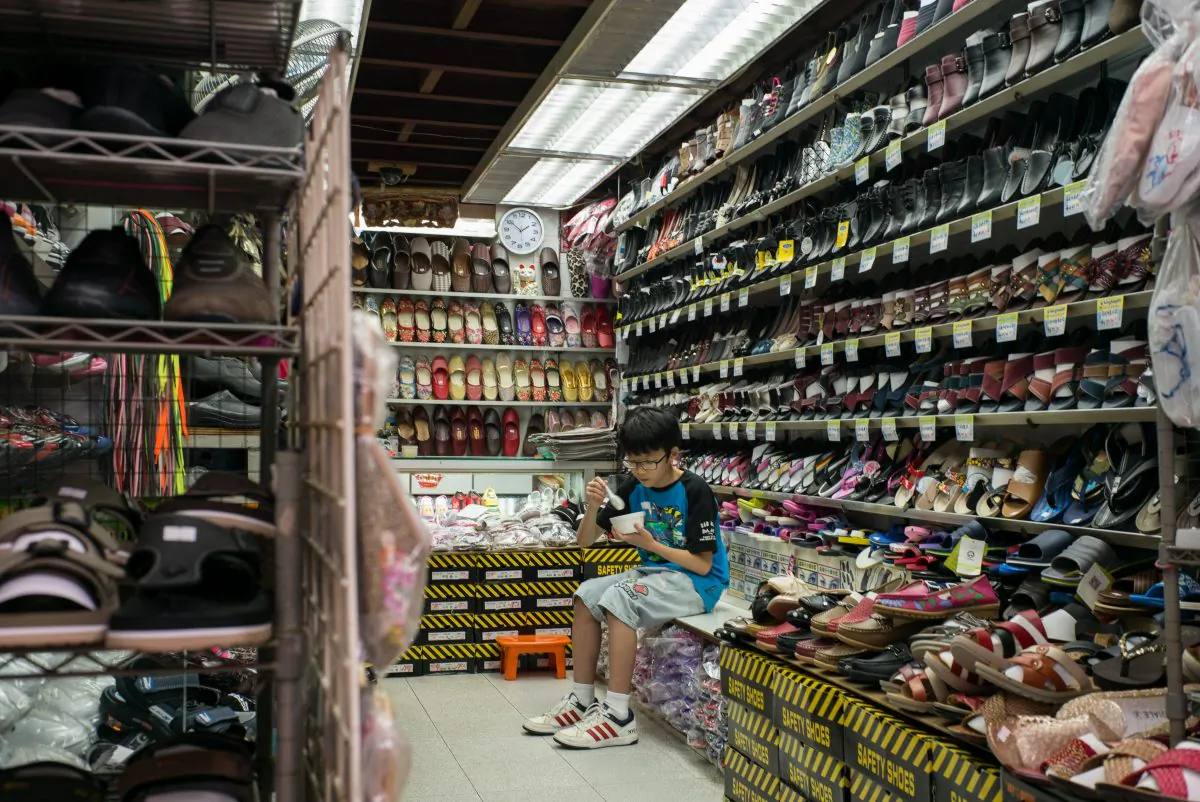 A boy at a shoe shop in a market in Hong Kong on July 6, 2016.   (Anthony Wallace/AFP/Getty Images)

 
 
 				


