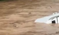 Watch: Camper Floats Down Flooded Pennsylvania Creek