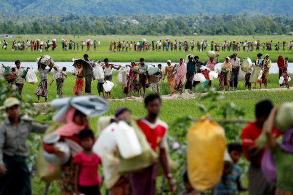 Rohingya refugees cross the border into Bangladesh from Burma