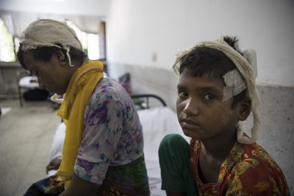 A Rohingya refugee and her daughter recover from wounds in Bangladesh