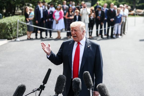 President Donald Trump talks to the media before leaving to Bedminster, N.J., at the White House in Washington
