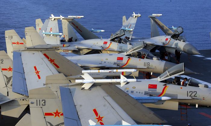 This undated photo taken in April 2018 shows J-15 multirole fighter jets on China's aircraft carrier, Liaoning, during a drill at sea. Pentagon’s new annual report on China’s military says that China is training its bombers for likely strikes against U.S. and allied forces. (AFP/Getty Images)