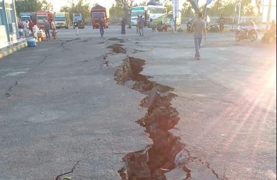 A crack emerges on a road at Kayangan Port after an earthquake hit Lombok