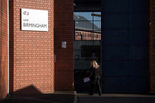 A member of prison staff arrives at HMP Birmingham, central England on December 17, 2016. Staff were found asleep and locking themselves away from prisoners during an inspection in August 2018 that resulted in the running of the G4S facility being taken over by the government. (Oli Scarff/AFP/Getty Images)