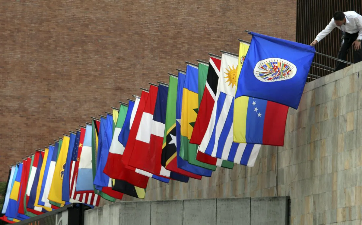 A worker prepares the flags of the Organization of American States (OAS) in Medellin, Colombia in this file photo. (RAUL ARBOLEDA/AFP/Getty Images)