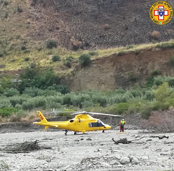 A rescue helicopter is seen after several people were killed in a mountain gorge flooding, in the municipality of Civita, Calabria, Italy on Aug. 20, 2018
