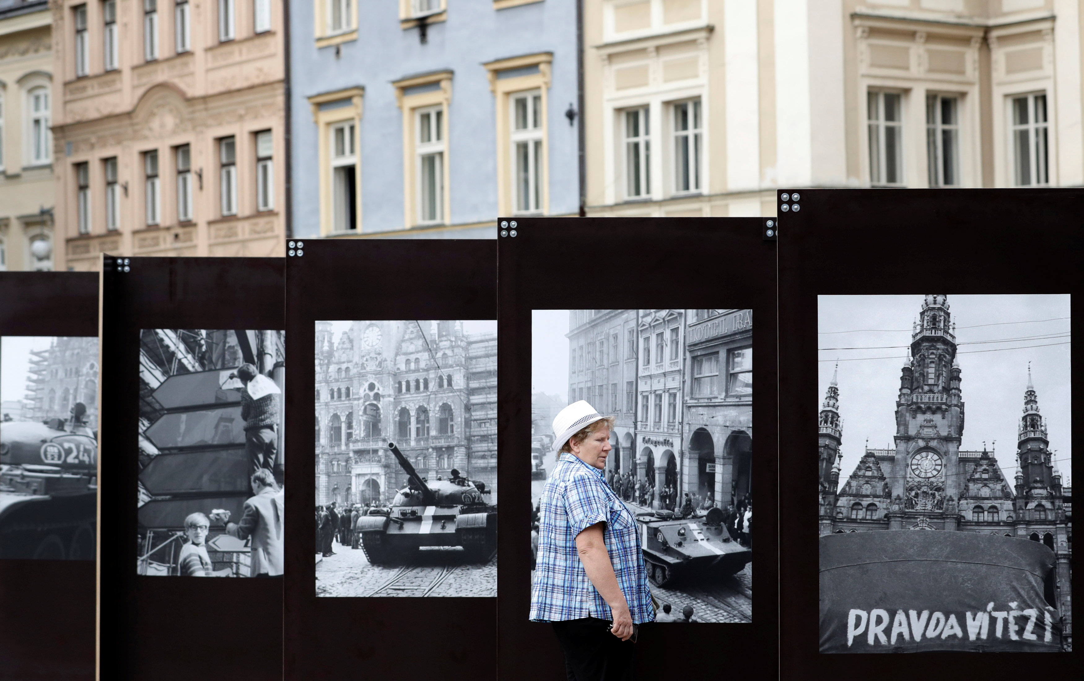 A woman looks at a pictures.