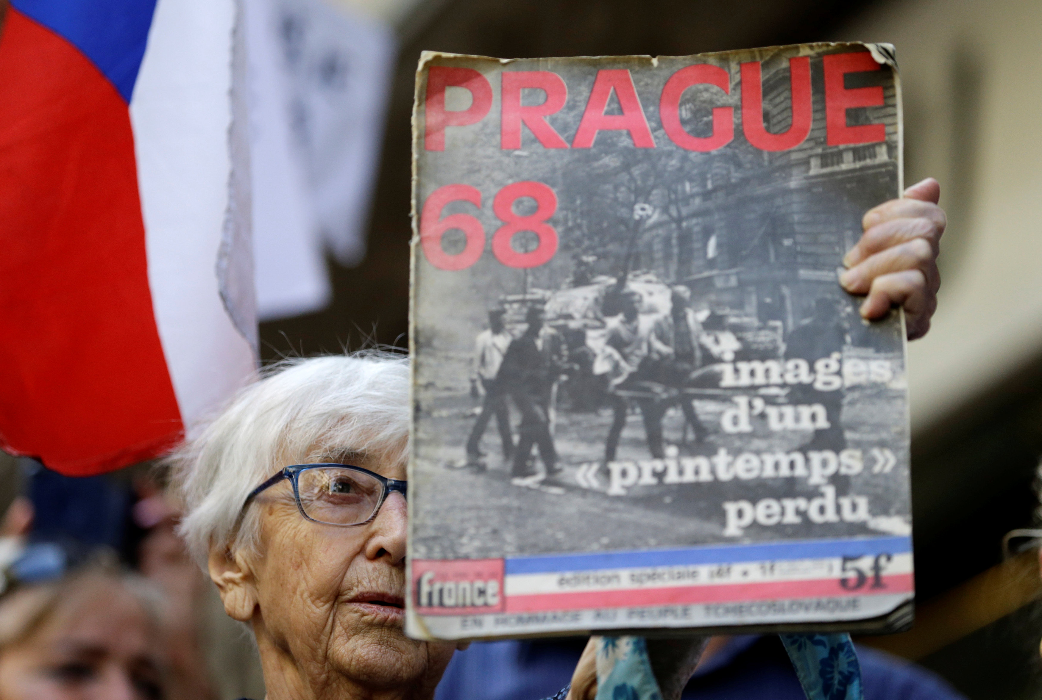A demonstrator holds a placard as she protests.