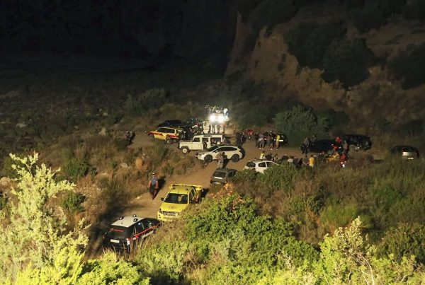 Rescuers are seen at the Raganello Gorge, a popular hiking spot in Civita on Aug. 20, 2018. 