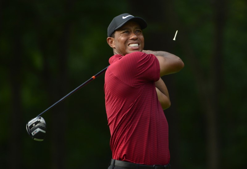 Tiger Woods hits his tee shot.