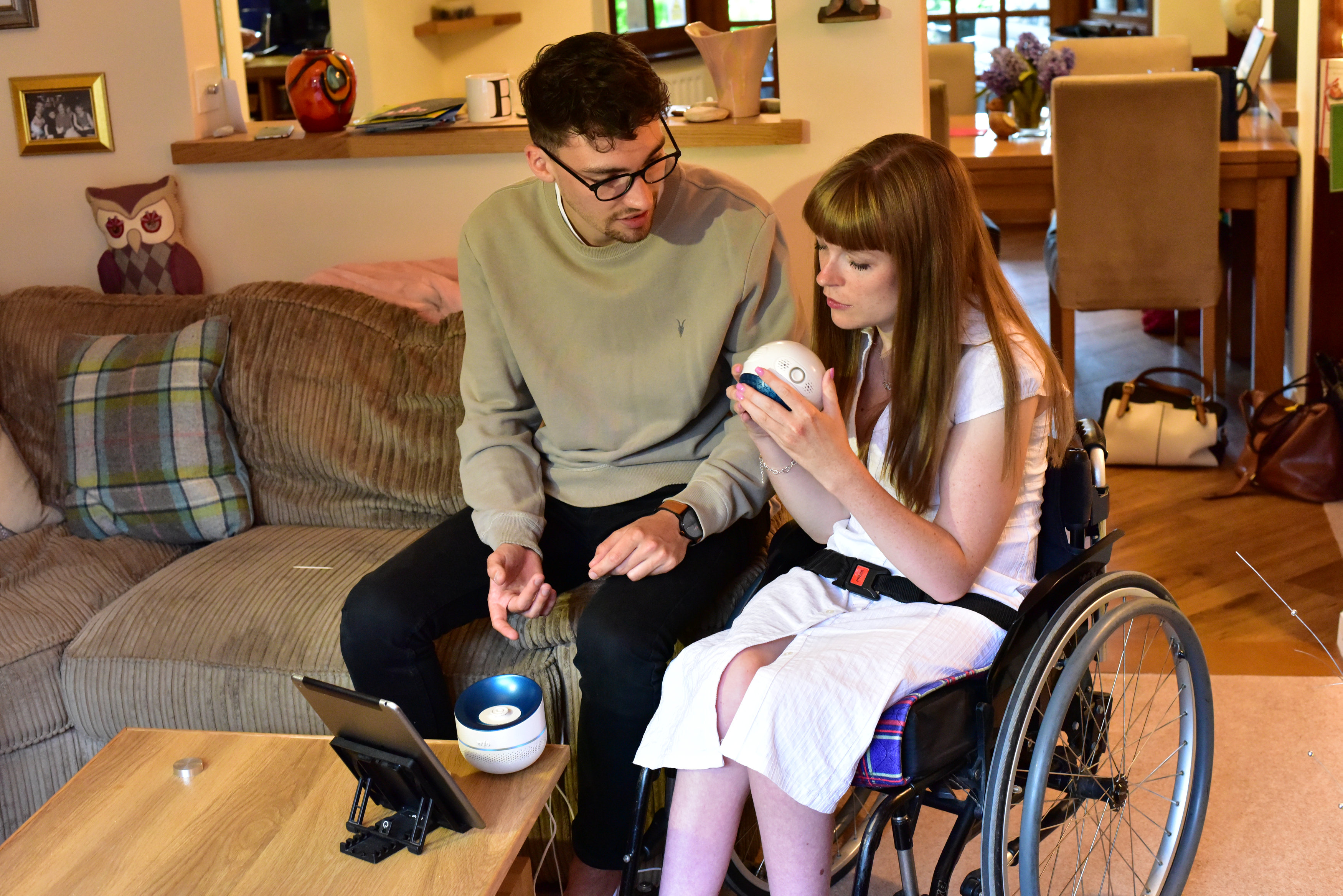Designer Billy Searle shows his sister Jess how to use 'Mylo'