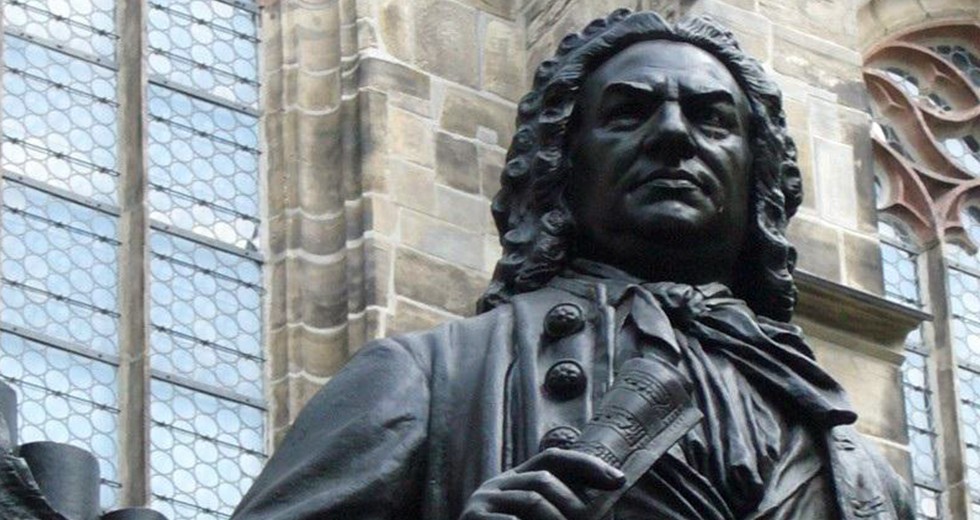 A statue of J.S. Bach in front of the St. Thomas Church in Leipzig, Germany. (Public Domain) 
