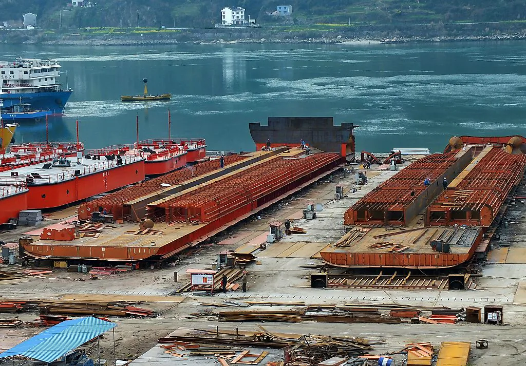 Laborers work in a shipyard in Yichang, central China's Hubei province, on March 1, 2015. (STR/AFP/Getty Images)